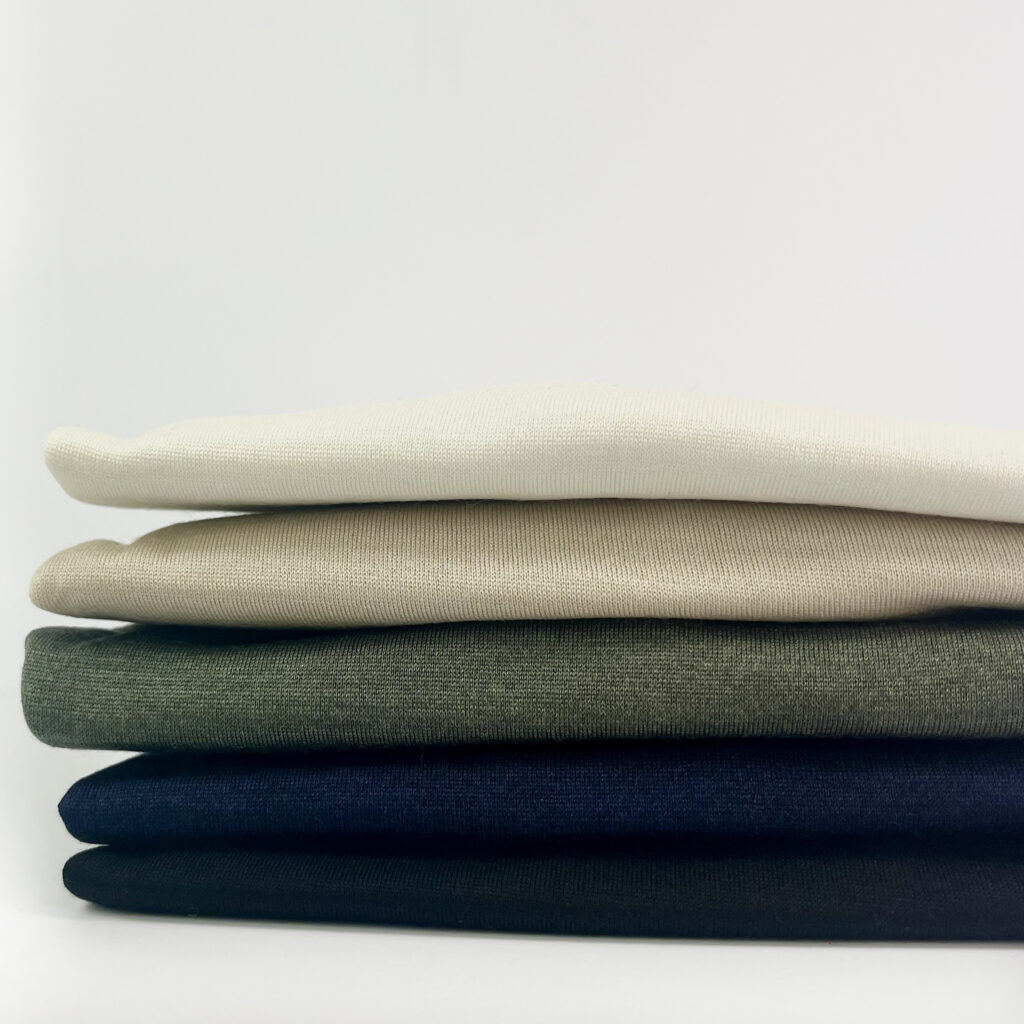 Folded pile of turtle neck tops