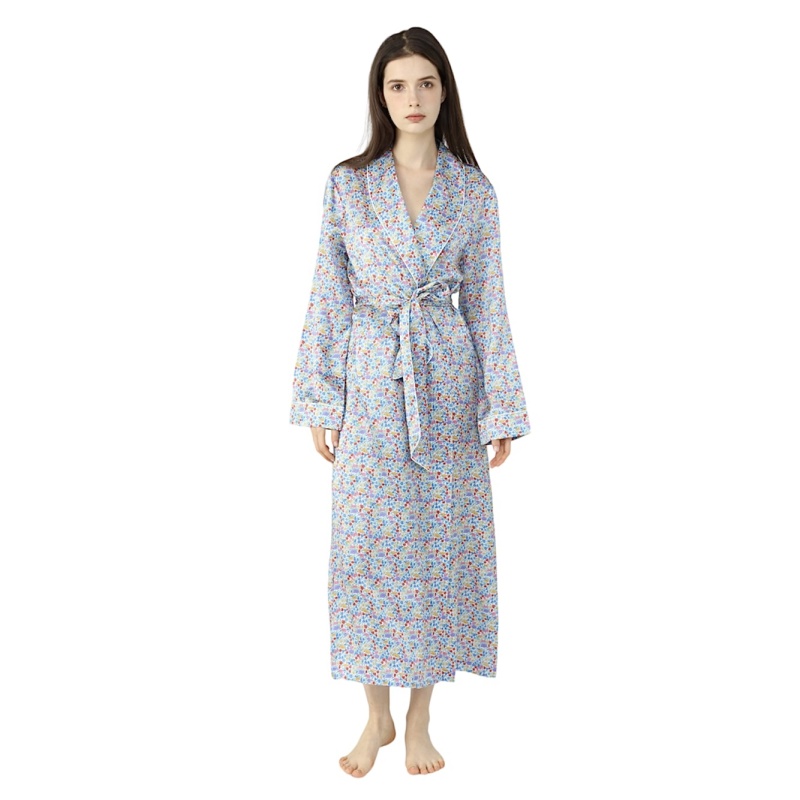 Brunette Lady wearing silk dressing gown in a light blue paisley print