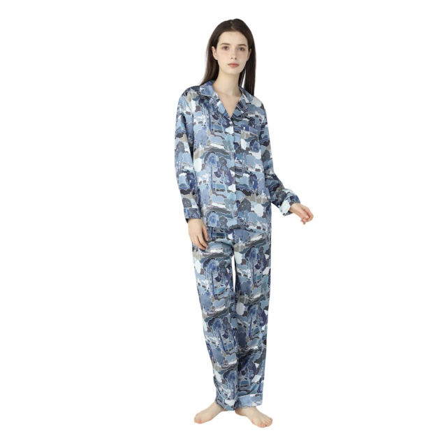 Brunette Lady wearing silk pyjamas in an abstract blue print